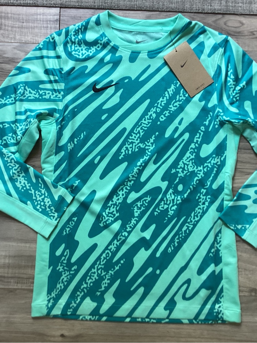 Nike big kids football/soccer shirt size M(NWT) ~PRICE IS FIRM, NO OFFERS~